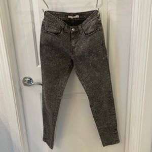 Levi’s, ankle skinny jeans, with button detail at ankle. Black acid wash look
